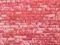 Texture of a beautiful unique unusual pink tender old cracked brick wall of rectangular bricks with seams painted with pink old Royalty Free Stock Photo