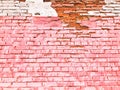 Texture of a beautiful unique unusual pink tender old cracked brick wall of rectangular bricks with seams painted with pink old Royalty Free Stock Photo