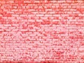 Texture of a beautiful unique unusual pink tender old cracked brick wall of rectangular bricks with seams painted with pink old Royalty Free Stock Photo