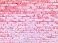 Texture of a beautiful unique unusual pink tender old cracked brick wall of rectangular bricks with seams painted with pink old Royalty Free Stock Photo