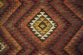 Texture of bedouin traditional wool carpet with geometric patter Royalty Free Stock Photo