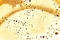 Texture of beige coffee foam