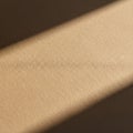 Texture of a beige, finely grained surface with diagonal light and shadow contrast. The surface Royalty Free Stock Photo