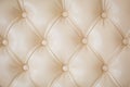 Texture beige leather sofa upholstery. Royalty Free Stock Photo