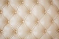 Texture beige leather sofa upholstery. Royalty Free Stock Photo