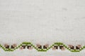 Texture of Beige Linen Fabric with Embroidery. Royalty Free Stock Photo