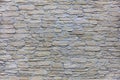 Texture of a beige stone wall of a large cobbled stone close-up Royalty Free Stock Photo
