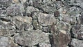 Texture of big real rock stone wall. Royalty Free Stock Photo