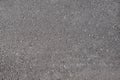Texture of black asphalt with small pits shot from above Royalty Free Stock Photo