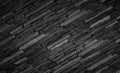 Texture of black brick slate wall, dark grey stone Royalty Free Stock Photo