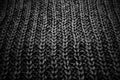 Texture of a black knitted sweater close up, dark knitted wool Royalty Free Stock Photo