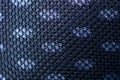 Texture of black plastic mesh on gray fabric Royalty Free Stock Photo