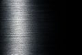 Texture of black polished anodized aluminum with light reflection