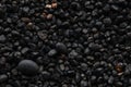 Texture of black volcanic sand for background. Black Sand beach macro photography. Close-up view of volcanic sand Royalty Free Stock Photo