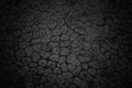 Texture of a black wall of small stones with rounded edges Royalty Free Stock Photo