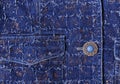 Texture of blue denim with gold threads. Beautiful blue button, pockets Royalty Free Stock Photo
