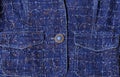 Texture of blue denim with gold threads. Beautiful blue button, pockets Royalty Free Stock Photo