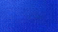 The texture of a blue, metallic mesh. Blue, braided background