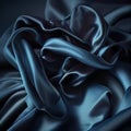 texture of blue silk fabric with folds and waves close-up, beautiful textile background Royalty Free Stock Photo