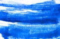 Texture of blue watercolor paint on white paper. Horizontal watercolour background. Royalty Free Stock Photo