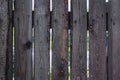 The texture of the boards of an old wooden fence closeup. Old wooden planks background. Royalty Free Stock Photo