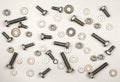 Texture of bolts, nuts, washers on a gray background Royalty Free Stock Photo