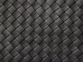 Braided texture of old black leather. Close up. Royalty Free Stock Photo