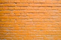 Texture of brick orange painted brown paint old brick wall with seams. The background Royalty Free Stock Photo
