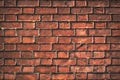 Texture of aged red brick wall with cracked weathered structure close-up for designer background Royalty Free Stock Photo