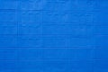 The texture of the brick wall of many rows of bricks painted in blue color  Background. Royalty Free Stock Photo