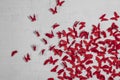 Red butterflies on a brick white wall, background texture. Royalty Free Stock Photo