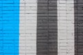 Texture of brick wall, painting of building in stripes