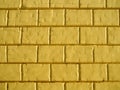 Background of a yellow wall of a city building. Royalty Free Stock Photo
