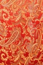 texture of bright red fabric with cucumbers Royalty Free Stock Photo