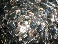 The texture of brilliant glass, precious diamond stones, fragments of rhinestones square pure light transparent silvery, decoratio Royalty Free Stock Photo