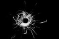 Texture of broken glass. Hole from a ball on a black background. Royalty Free Stock Photo