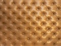 Texture of brown beige leather background with capitone pattern, full-frame. Brown retro Chesterfield style. Royalty Free Stock Photo