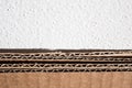 Texture of brown cardboard side. Folded cardboard boxes against