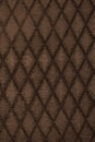 Texture of brown fabric with rombic pattern