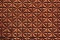 Texture of brown rhombs of the concrete wall of the house built in the USSR