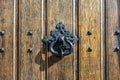 Texture of brown wooden door with metall doorhandle