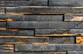 Texture of burnt boards. Blackened charred wood planks with light veins. Burnt scratched hardwood surface. Background Halloween