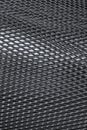 Texture of cambered metal perforated netted sheet with lighting effect.