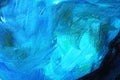 Texture of a canvas with large brushstokes of blue oil paint. Royalty Free Stock Photo