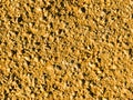 Old yellow concrete wall close-up. Royalty Free Stock Photo