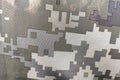 Texture close-up pixel camouflage military uniform of the Armed Forces
