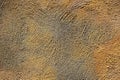 Texture of coarse plaster of yellow and gray colors on the wall Royalty Free Stock Photo