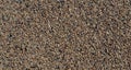 Texture of coarse sea sand close-up, small pebbles. For design, background, postcards Royalty Free Stock Photo