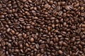 Texture of coffee beans scattered randomly. Brown texture Royalty Free Stock Photo