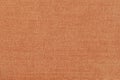 Texture of colorful canvas or burlap closeup, coral or peach color, modern background